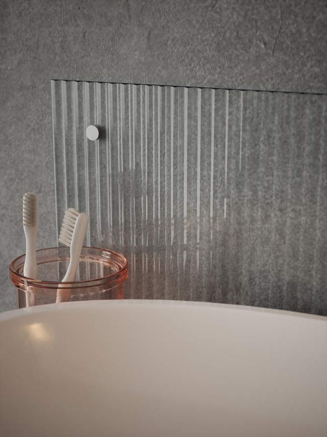 Fluted Clear Glass Bathroom Splashback - with brushed chrome caps
